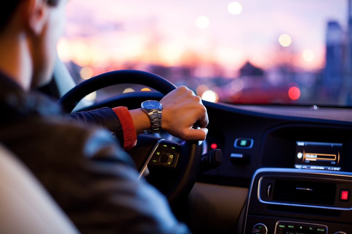 Person driving a car at night